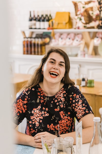 Women who dress in black and red shirt smiles
